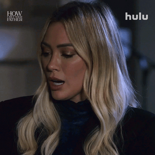 a close up of a woman 's face with the words how i met your father above her