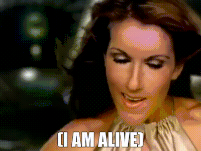 A Close Up Of A Woman 'S Face With The Words " I Am Alive " Above Her GIF