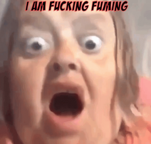 A Close Up Of A Woman 'S Face With The Words I Am Fucking Fuming Written Above Her GIF