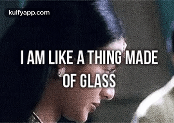 a close up of a woman 's face with the words `` i am like a thing made of glass '' written on it .