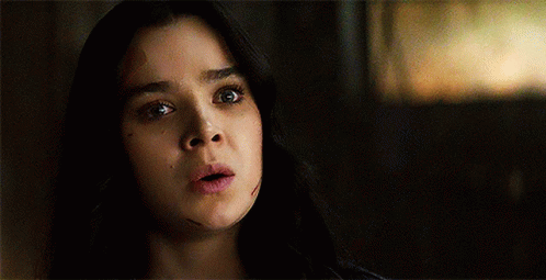 A Close Up Of A Woman 'S Face With The Words `` I Did N't See That Coming '' Written Below Her . GIF