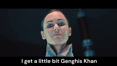 A Close Up Of A Woman 'S Face With The Words I Get A Little Bit Genghis Khan Below Her GIF