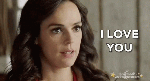 A Close Up Of A Woman 'S Face With The Words I Love You Written On It GIF