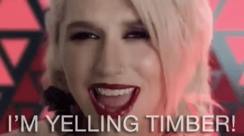 A Close Up Of A Woman 'S Face With The Words `` I 'M Yelling Timber '' Written Below Her . GIF