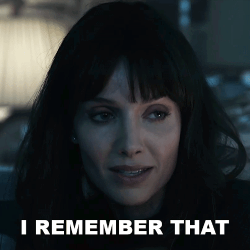 A Close Up Of A Woman 'S Face With The Words I Remember That Behind Her GIF