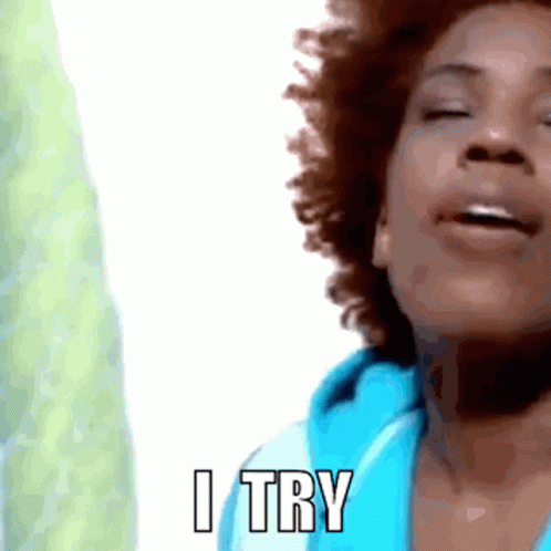 A Close Up Of A Woman 'S Face With The Words I Try Above Her GIF