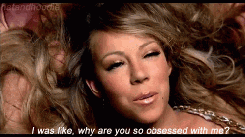 A Close Up Of A Woman 'S Face With The Words I Was Like Why Are You So Obsessed With Me Written Below Her GIF