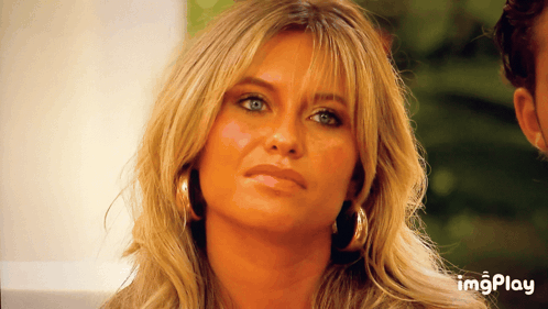 a close up of a woman 's face with the words imgplay below