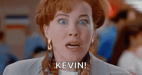 A Close Up Of A Woman 'S Face With The Words `` Kevin '' Written On It . GIF
