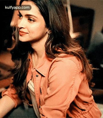 A Close Up Of A Woman 'S Face With The Words Kulfyapp.com On The Bottom Right GIF