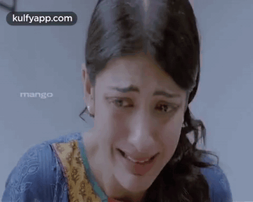 A Close Up Of A Woman 'S Face With The Words Kulfyapp.com Written On The Bottom GIF