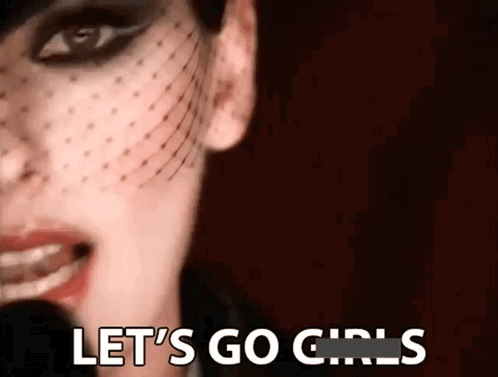 A Close Up Of A Woman 'S Face With The Words Let 'S Go Girls Written On It GIF