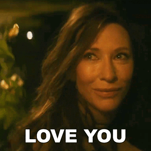A Close Up Of A Woman 'S Face With The Words Love You Written On It GIF