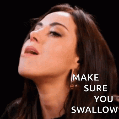 A Close Up Of A Woman 'S Face With The Words `` Make Sure You Swallow '' On It . GIF