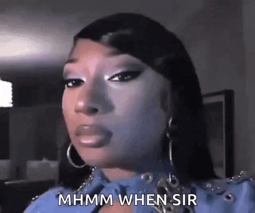 A Close Up Of A Woman 'S Face With The Words Mhmm When Sir Written On It . GIF