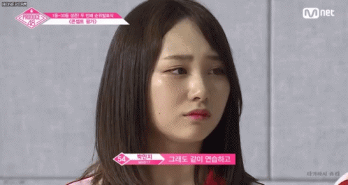 A Close Up Of A Woman 'S Face With The Words Mnet On The Bottom GIF