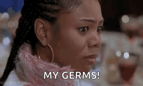 A Close Up Of A Woman 'S Face With The Words `` My Germs '' Written On Her Face . GIF