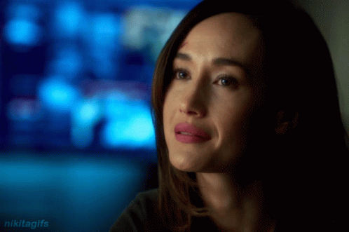A Close Up Of A Woman 'S Face With The Words Nikitagifs In The Lower Right Corner GIF