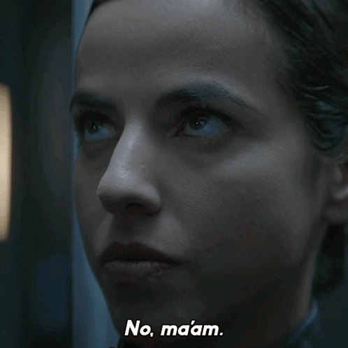 A Close Up Of A Woman 'S Face With The Words No Maaam Written Below Her GIF
