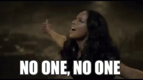 A Close Up Of A Woman 'S Face With The Words `` No One , No One '' . GIF