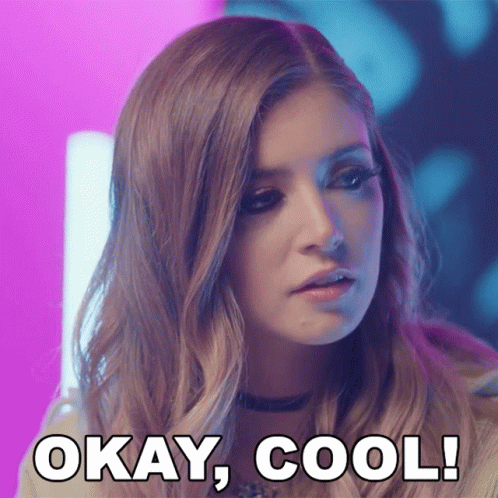 A Close Up Of A Woman 'S Face With The Words Okay Cool Behind Her GIF