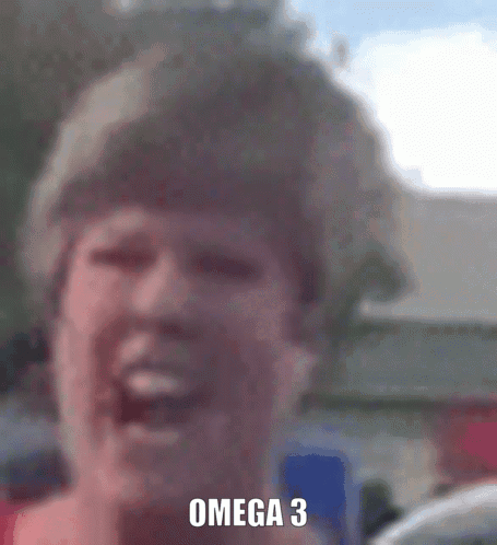 A Close Up Of A Woman 'S Face With The Words Omega 3 Written On It GIF