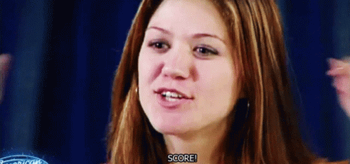 A Close Up Of A Woman 'S Face With The Words Score Visible GIF