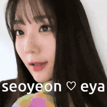 A Close Up Of A Woman 'S Face With The Words Seoyeon Eya Written Below Her GIF