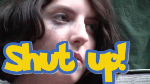 A Close Up Of A Woman 'S Face With The Words Shut Up Above Her Mouth GIF