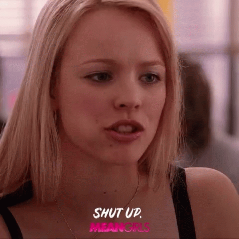 A Close Up Of A Woman 'S Face With The Words Shut Up Mean Girls Written Above Her GIF