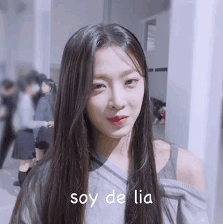A Close Up Of A Woman 'S Face With The Words Soy De Lia Written Below Her . GIF