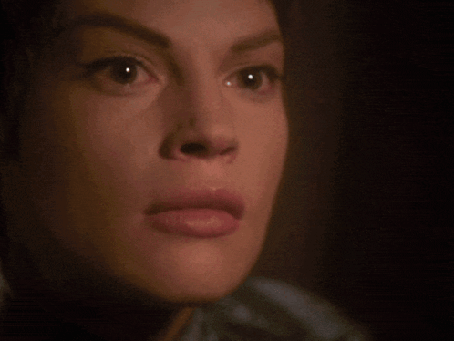 A Close Up Of A Woman 'S Face With The Words " Stop Talking " Below Her GIF