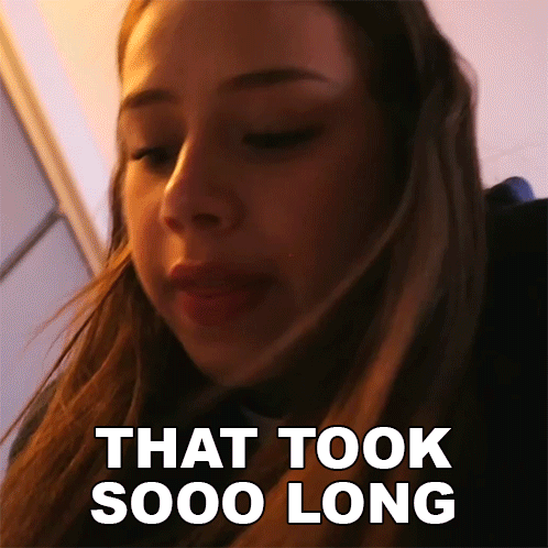 A Close Up Of A Woman 'S Face With The Words That Took Sooo Long Behind Her GIF