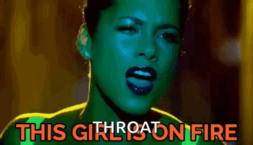 A Close Up Of A Woman 'S Face With The Words `` This Girl Is On Fire '' Written On The Bottom . GIF