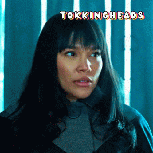 A Close Up Of A Woman 'S Face With The Words " Tokingheads " Above Her GIF
