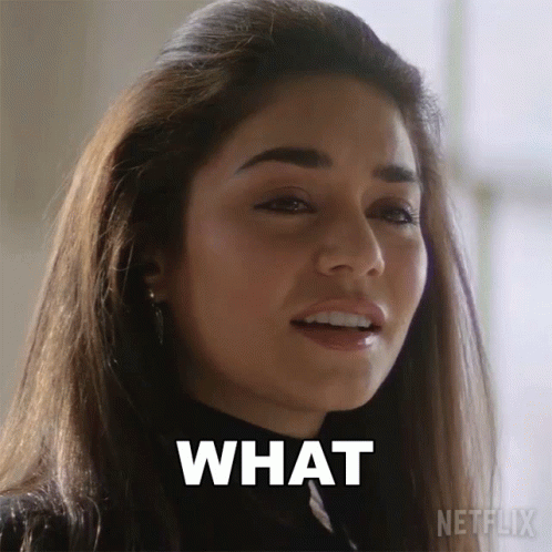 A Close Up Of A Woman 'S Face With The Words What Written On Her Face GIF