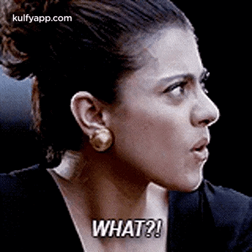 A Close Up Of A Woman 'S Face With The Words `` What '' Written On It . GIF