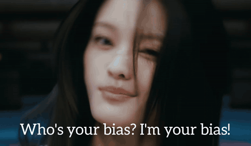 A Close Up Of A Woman 'S Face With The Words Who 'S Your Bias I 'M Your Bias Below Her GIF