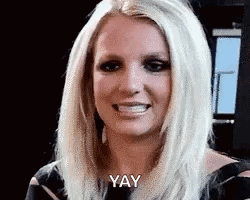 A Close Up Of A Woman 'S Face With The Words `` Yay '' Written On It . GIF