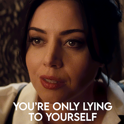 A Close Up Of A Woman 'S Face With The Words You 'Re Only Lying To Yourself Above Her GIF
