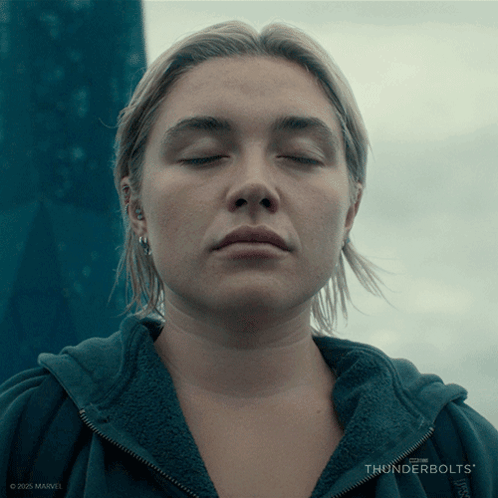 a close up of a woman 's face with thunderbolts written on the bottom right