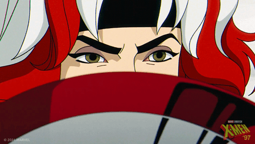 A Close Up Of A Woman 'S Face With Xmen Written On The Bottom Right GIF