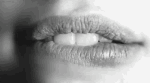 A Close Up Of A Woman 'S Lips With Lipstick On Them . GIF