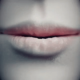 A Close Up Of A Woman 'S Lips With Red Lipstick On GIF