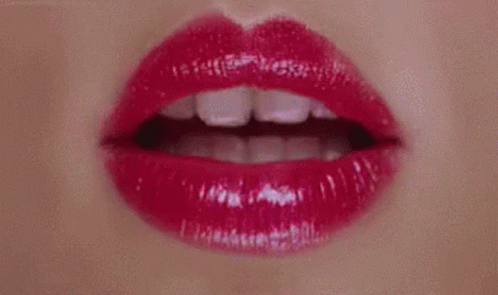 A Close Up Of A Woman 'S Lips With Red Lipstick On . GIF