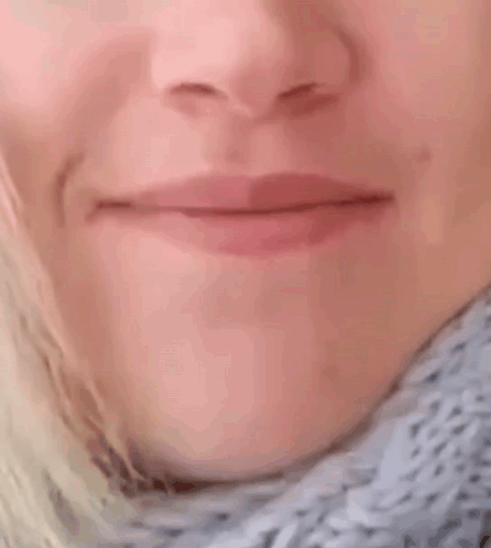 A Close Up Of A Woman 'S Mouth With Her Mouth Wide Open GIF