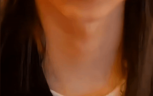 a close up of a woman 's neck and chest