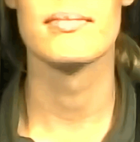 A Close Up Of A Woman 'S Neck With A Shadow On It GIF