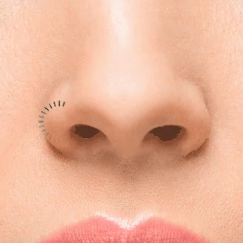 A Close Up Of A Woman 'S Nose With A Few Lashes Visible GIF