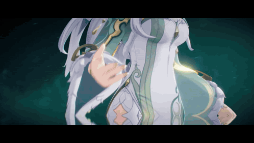 A Close Up Of A Woman 'S Torso In A White And Green Dress GIF